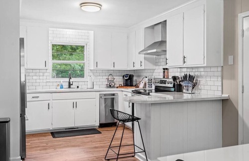 Greensboro House | The Boro Bungalow. A Mid-modern home. King beds.