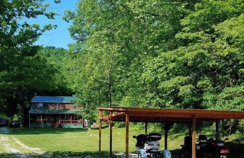 Fort Gay Cabin | The Bunkhouse A two story rustic cabin 3BR 2BA