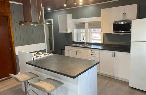 Selwyn House | The Canadiana - Rustic Beachfront Cottage