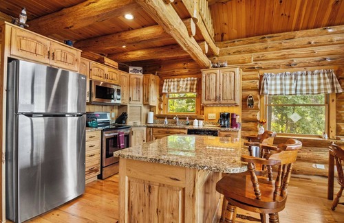 Bellaire House | THE CLAM SHELL Log Home on Clam Lake
