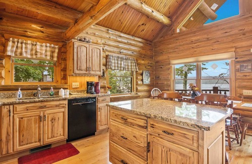 Bellaire House | THE CLAM SHELL Log Home on Clam Lake