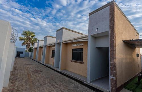 Soroti Apartment | The Den Soroti Red & White
