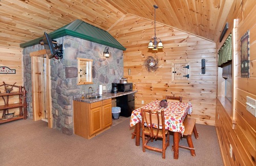 Flintstone Ski Chalet | The double cabin has 2 queen beds, 1 king bed, 1 sleep sofa for 1 child. Cabin has common porch and each unit has a private entrance.