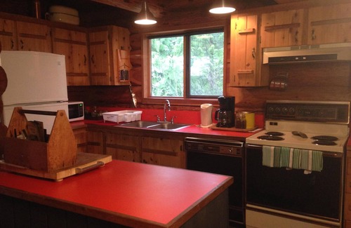 Halfmoon Bay Cabin | The Enchanted Woods Waterfront Log Cabin at Secret Cove
