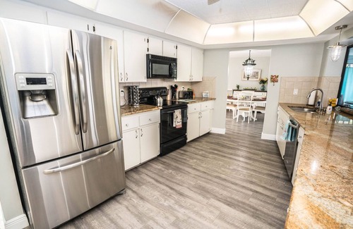 Apollo Beach House | The Flamingo- Waterfront Home with heated pool, hot tub and kayaks!