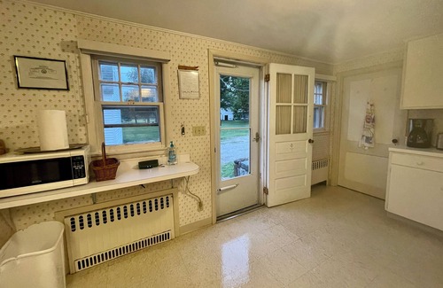 Pipes Cove Cottage | 'The Gate House'on Beach front Estate with Dockage. Walk to Village .