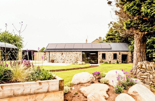 Downpatrick Villa | The Goat House Retreat offers an idyllic getaway.