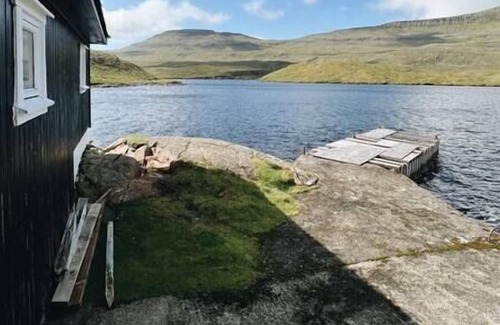 Faroe Islands Apartment | The Hidden People's Cottage by Vatnses Lake