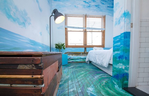 Queens Condo | The High Tide Studio #6 Studio Bedroom Hotel Room by RedAwning