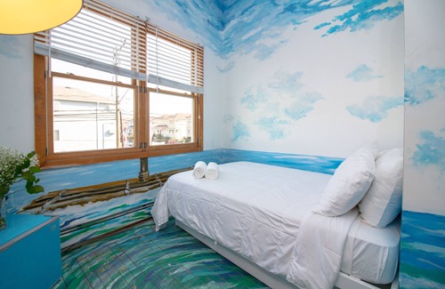 Queens Condo | The High Tide Studio #6 Studio Bedroom Hotel Room by RedAwning