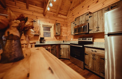 Rockbridge Cabin | The Hilltop - The Hilltop at Pine Creek Cabins and Camping in Hocking Hills, just minutes from Hocking Hills State Park. A cozy, yet spacious, pet-friendly cabin perfect for a reset surrounded by nature! Book your getaway today!
