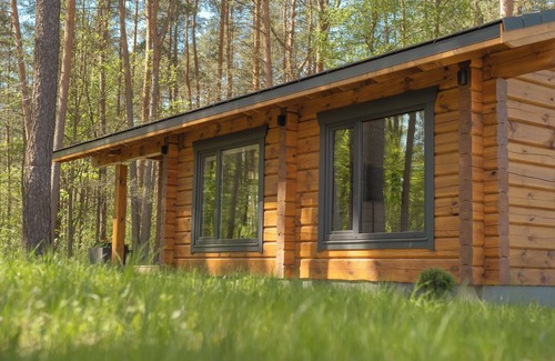 Klykiai House | The house is located in a quiet area, surrounded by forest pines.