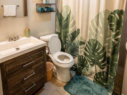 Savannah Victorian District Apartment | The Jungle Nook - Themed Getaway,Backyard,Grill