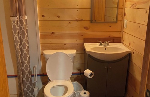 Luverne Cabin | The Little Red Barn - Lakeside Tiny Home Rental -Sleeps 4 - Spiral Staircase