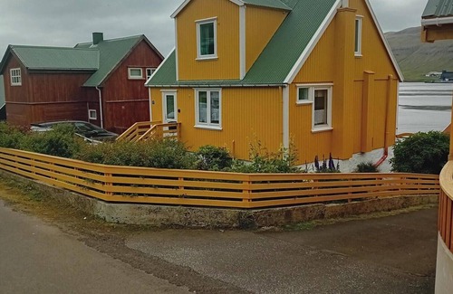 Trongisvagur Villa | The Little Yellow House Cozy Old Faroese wooden house.