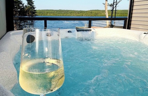 Halifax County House | The Luxurious Lakefront Reset on Porters Lake with private beach and hot tub!