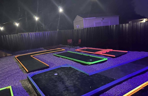 Columbus House | The Mini Golf Oasis king beds & Movie/Game room minutes to Fort Benning GA.