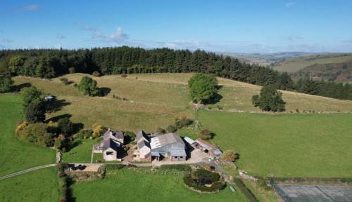 Oswestry House | The Nook at Pentregaer Ucha, with tennis court & lake.
