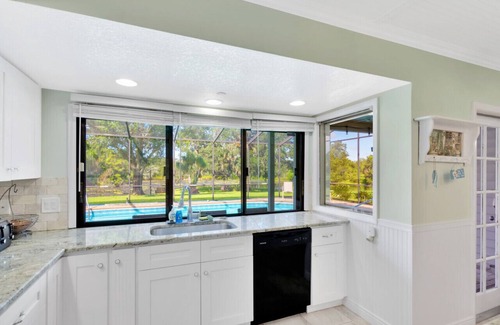 Lakeview Village House | The Oak house. HEATED Pool. Waterfront. Fire pit. Swings