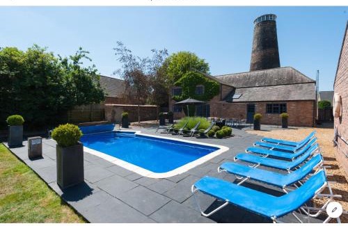 Stoke Ferry House | The Old Mill, 7 storey, dog friendly outdoor pool & bbq