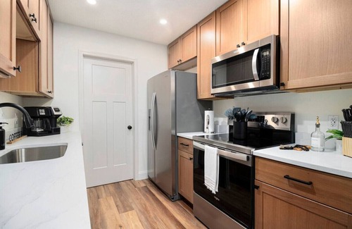 Sioux Falls Apartment | The Olive Branch | Beams & Fireplace | Wine Bar