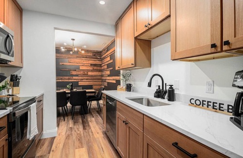 Sioux Falls Apartment | The Olive Branch | Beams & Fireplace | Wine Bar