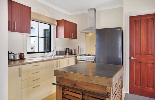 Wainui House | The Parish House with Pool, BBQ and Pizza Oven