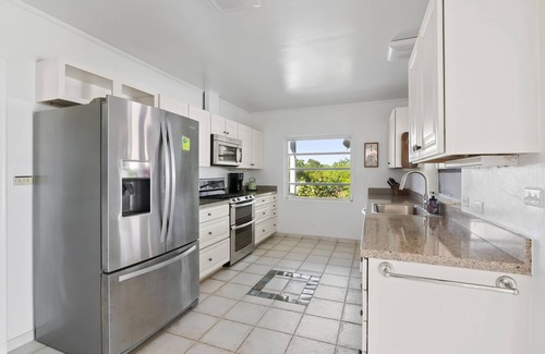 George Town House | The Pink House vacation rental, magnificent pool and view over Elizabeth harbor
