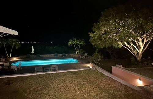 George Town House | The Pink House vacation rental, magnificent pool and view over Elizabeth harbor