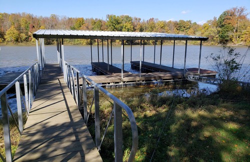 Cannelton Cabin | The Point is a waterfront rental with covered boat dock at Rocky Point Indiana