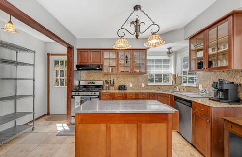 Oak Cliff House | The private home features two master suites with King beds and full attached bathrooms. The loft is 3rd private getaway with a Queen bed and attached full bath. Fully stocked kitchen and a separate Oak dining area.