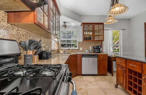 Oak Cliff House | The private home features two master suites with King beds and full attached bathrooms. The loft is 3rd private getaway with a Queen bed and attached full bath. Fully stocked kitchen and a separate Oak dining area.