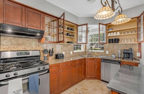 Oak Cliff House | The private home features two master suites with King beds and full attached bathrooms. The loft is 3rd private getaway with a Queen bed and attached full bath. Fully stocked kitchen and a separate Oak dining area.
