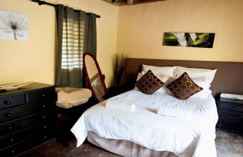 Leribe District House | The Queen-Size-Bed Riverside Huts