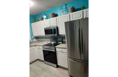 Sabal Harbour Condo | The Seabreeze Cottage with peaceful water views