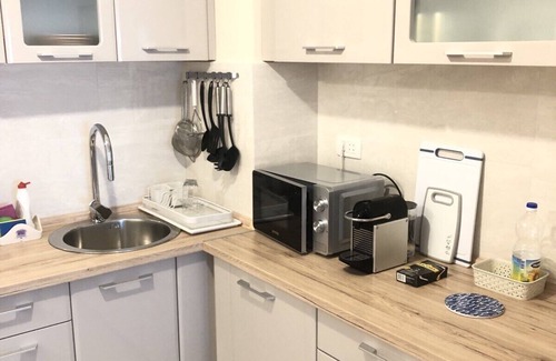 Bar Apartment | The SunshineLiving apartment is a 10-minute walk from the beach.