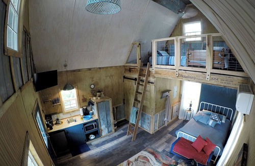 Mentone Cottage | The Treehouses on wooded acreage that overlook a large lake.