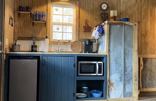 Mentone Cottage | The Treehouses on wooded acreage that overlook a large lake.
