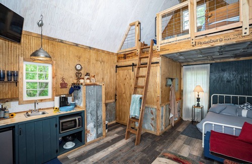 Mentone Cottage | The Treehouses on wooded acreage that overlook a large lake.