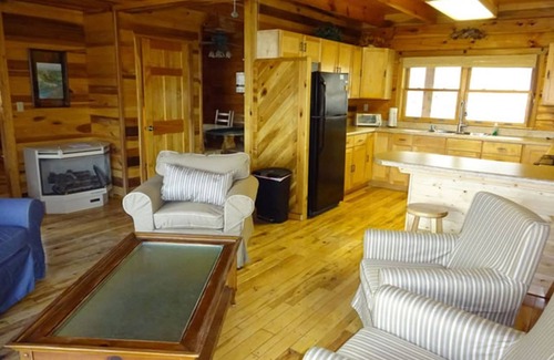 True Cabin | The West Virginian 3 storey log cabin in 10 acre wooded area adjacent to Pipestem State Park and Resort.