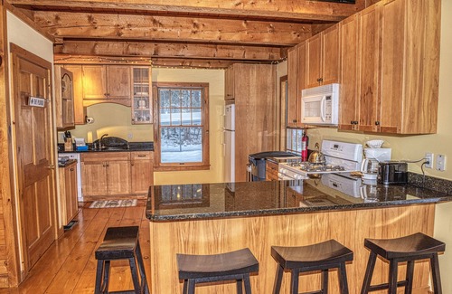 Belmont Ski Chalet | The Whimsical Chalet is a lovely cape on acres. Private setting less than 10 minutes to skiing.