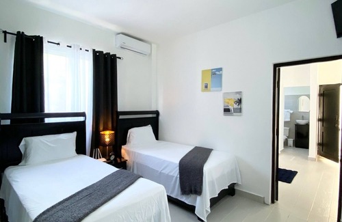 Juan Dolio Bed & Breakfast | The white rock villa this 9 bedroom 9 bathroom offer fee continental breakfast