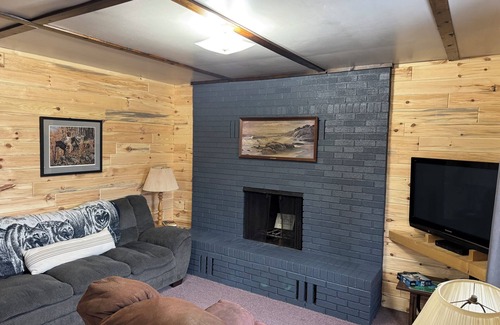Gould City Cabin | The Wolf Den at Sunset Pines Resort