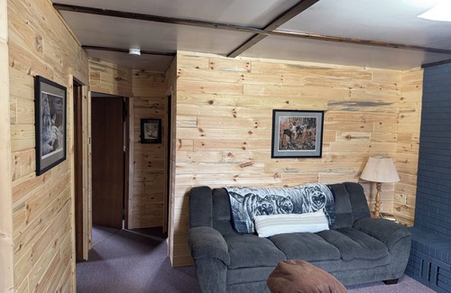 Gould City Cabin | The Wolf Den at Sunset Pines Resort