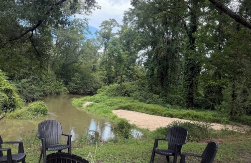Fluker House | The Woods Camp w/fire pit, propane grill, and waterfront view on the River