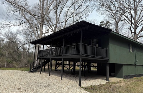 Fluker House | The Woods Camp w/fire pit, propane grill, and waterfront view on the River