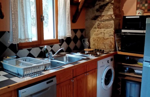 Yzeron Cottage | The yellow cottage, made of stone and wood