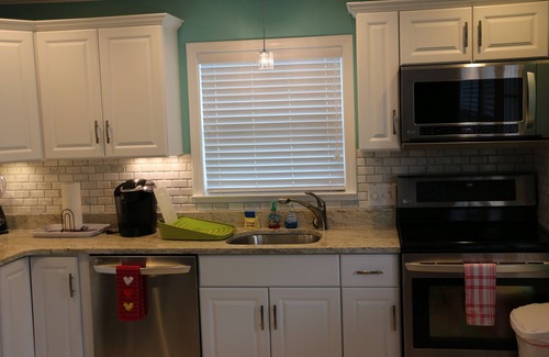 Lower Grand Lagoon House | This adorable cottage is DIRECTLY ON THE BEACH-RARE FIND!