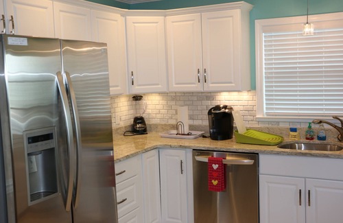 Lower Grand Lagoon House | This adorable cottage is DIRECTLY ON THE BEACH-RARE FIND!