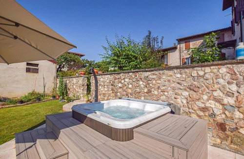 Castellaro Lagusello Apartment | This beautiful vacation apartment on two floors overlooks the courtyard of a stone house from 1785.